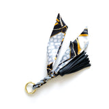 Bag charm tassel with a twilly scarf in black and grey scarf