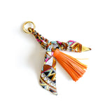 Bag charm tassel with a twilly scarf in orange