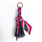 Bag charm tassel with a twilly scarf in black and magenta