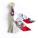 Bag charm tassel with twilly scarf design with a red scarf