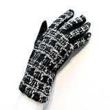 Fashionable and affordable black and white tweed design with black faux-suede worn