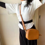 Tan camera leather bag, made in Italy, with crossbody strap